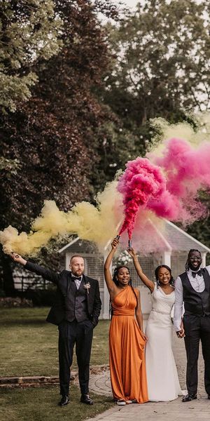 Hayne House wedding with black couple, orange bridesmaid dresses and colourful smoke bomb portraits 