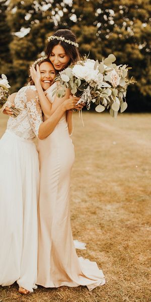 Bride and bridesmaid embracing as you can see the friendship between them