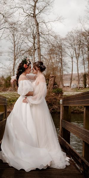 Ethereal wedding dress and inspiration at Mapledurham House and Estate with two brides and romantic flowers by Katherine And Her Camera