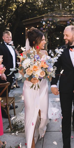 Confetti exit from Bowers Mill outdoor wedding ceremony with pastel wedding theme 
