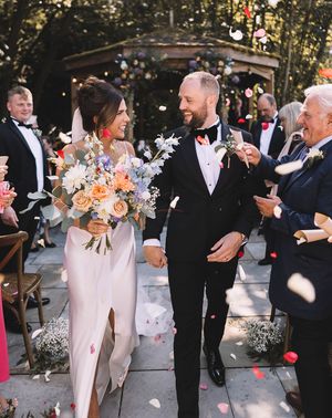 Confetti exit from Bowers Mill outdoor wedding ceremony with pastel wedding theme