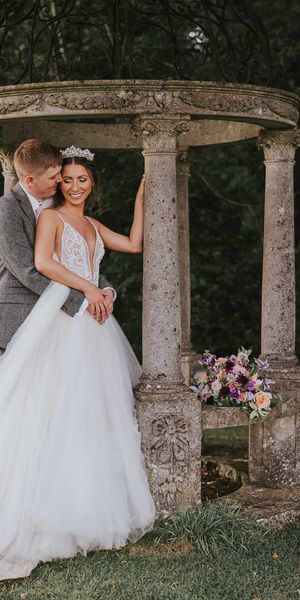 Rustic summer wedding complete with a fun hydration station and a pink and grey colour scheme.