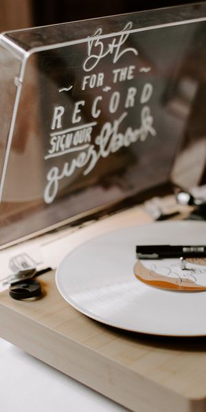 Record player alternative wedding guest book idea.
