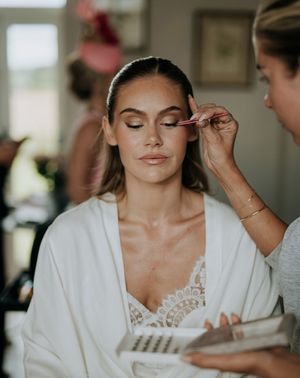 bride gets makeup done for wedding day pre wedding beauty