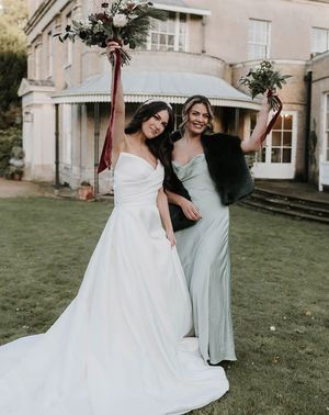 maid of honour wearing faux fur shawl with bride hannah partridge photography