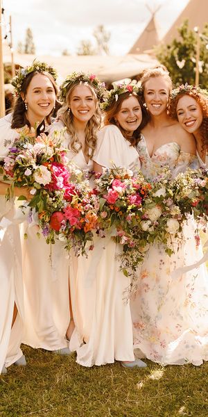 bridesmaids-wearing-ivory-dresses-with-flower-crowns-at-garden-wedding