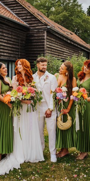 bridal-party-wearing-dark-green-pleated-bridesmaid-dresses