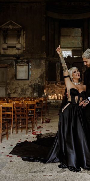 bride-wearing-custom-black-wedding-dress-with-groom-at-gothic-wedding