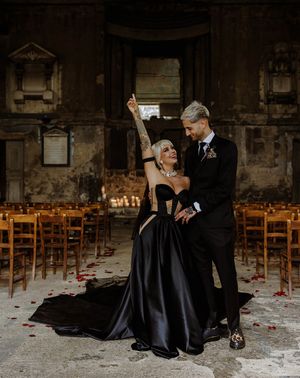 bride-wearing-custom-black-wedding-dress-with-groom-at-gothic-wedding