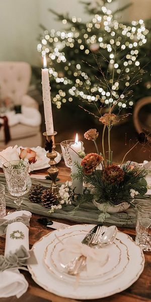 Sage green festive Christmas table decorations and Christmas crackers