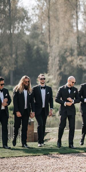 group photo of groomsmen in black-tie
