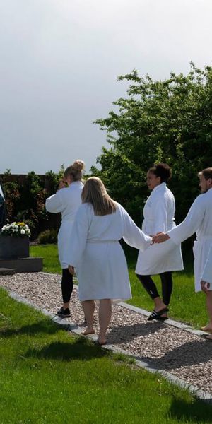 guests walking to mindfulness dome at glass house wellness retreat in essex