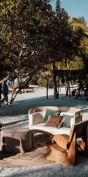 Two wooden stools and chair wedding furniture for Holbox, Mexico, destination beach wedding