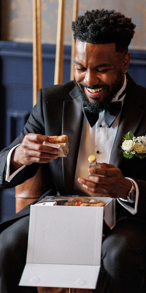 Groomsmen gift box unboxing on wedding morning