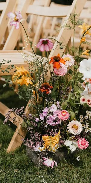 spring wedding flowers meadow aisle arrangement