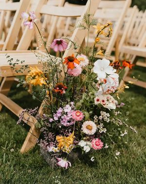spring wedding flowers meadow aisle arrangement