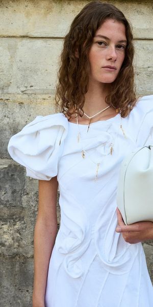 Gabriela Hearst designer sustainable wedding dress with puff sleeves in ivory linen