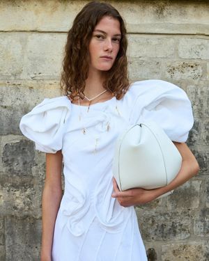 Gabriela Hearst designer sustainable wedding dress with puff sleeves in ivory linen