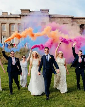 Wedding party at the Grange Hampshire wedding venue with colour smoke cannons