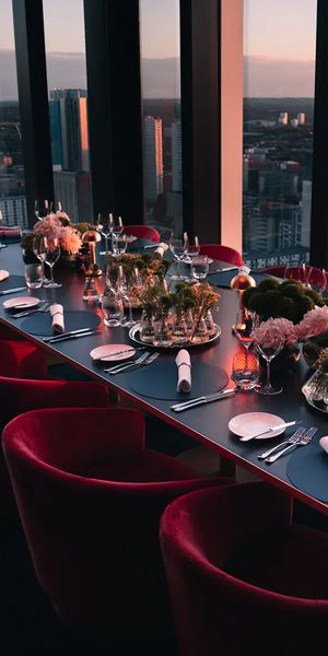 orelle rehearsal dinner private room table set up with floor to ceiling windows
