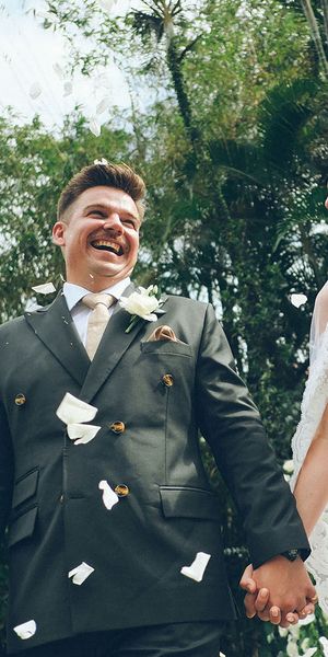 Couple who used Gather holding hands on their wedding day