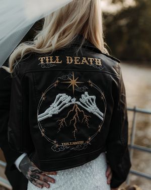 The best bridal cover ups with bride wearing personalised leather jacket