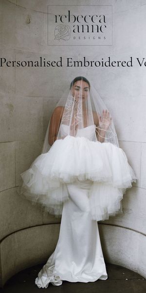 A modern bride wearing a drop wedding veil with a ruffled tulle edge and personalised embroidery by Rebecca Anne Designs, captured by Scarlett Cook Photography.