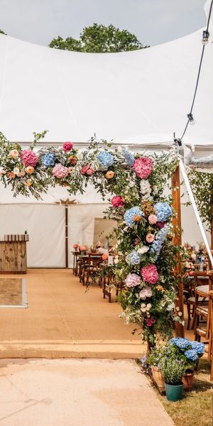 Vibrant Summer Marquee Entrance. Photographer: Stephanie and Nicole Wedding Photography