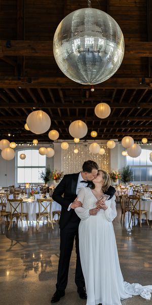 Bride and groom under disco ball at Trinity Buoy Wharf Sofia yang martinez Photography 