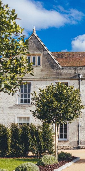 Froyle Park manor house exterior with blue sky