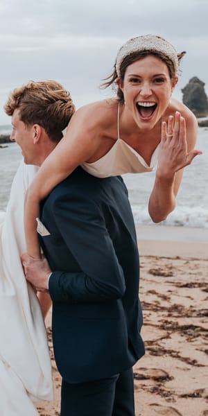 Bride and Groom celebrating saying I do on Devon Beach - South Milton