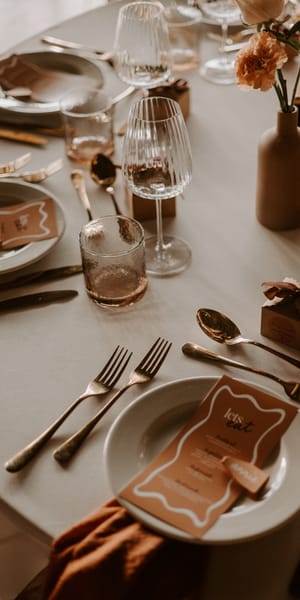 Scrumptious, warm, late summer wedding tablescape. Photograph by Louise Anna Photography.