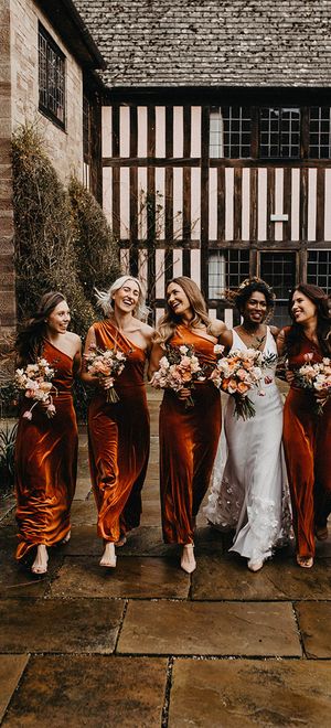 autumn bridesmaid dresses for bridal party in matching orange gowns