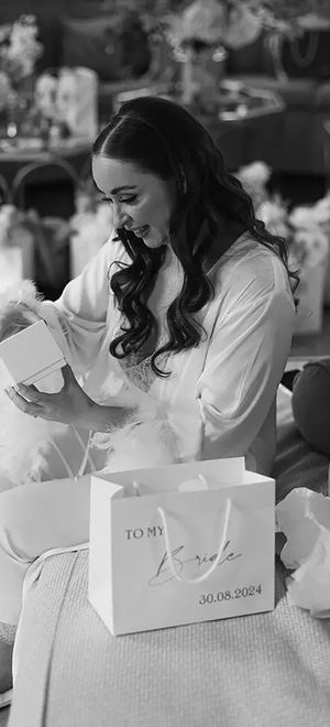 bride opening gifts on the wedding morning