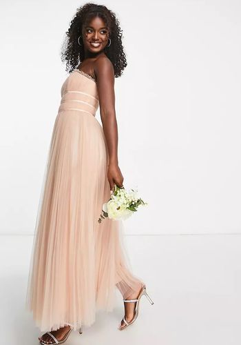 Blush peach bridesmaid dress from ASOS with strapless design and tulle maxi skirt