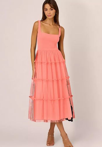 Coral peach bridesmaid dress from Adrianna by Adrianna with midi length and mesh design