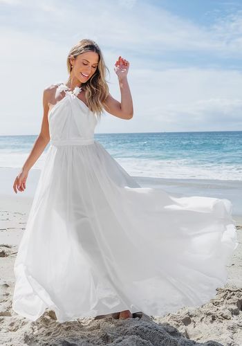 White beach wedding dress with floral halter neckline straps and low back from Cupshe