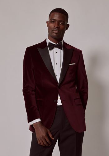 Festive wedding guest dress code idea for men from Hawes and Curtis - burgundy velvet suit  