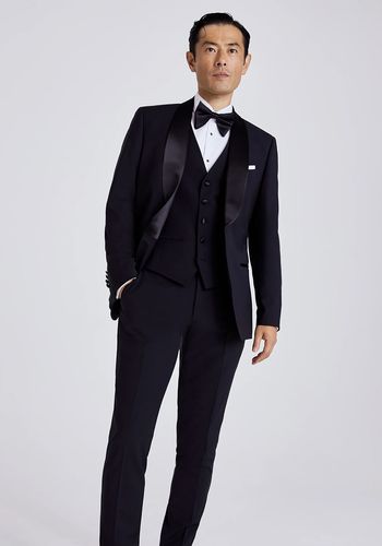 Moss Bros model wearing black tie wedding suit for groom