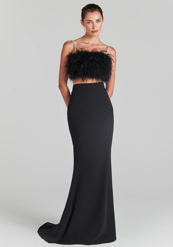 Black two piece wedding dress from Nadine Merabi with feather crop top and black maxi skirt