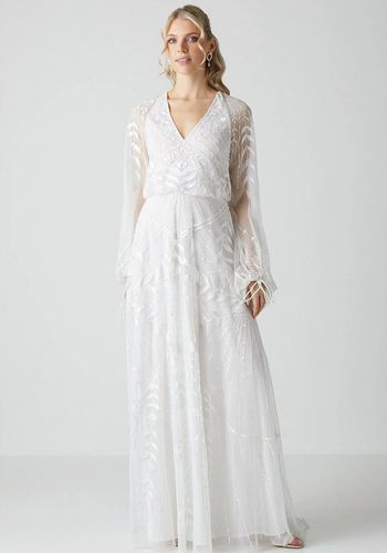 Boho beach wedding dress from Coast with lightweight embroidered mesh sleeves 