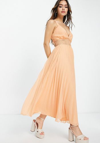 Peach bridesmaid dress from ASOS with lace insert and pleated skirt design 