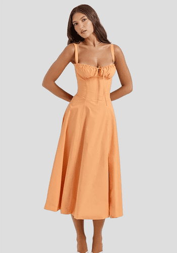 Orange peach bridesmaid dress from House of CB with gathered cup bodice and midi length 