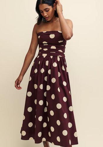 Brown autumn wedding guest dress with white polkadots 