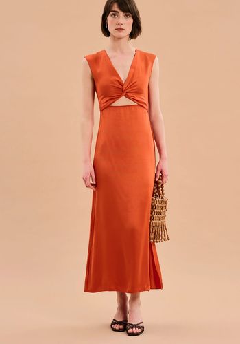 Burnt orange autumn wedding guest dress from Omnes