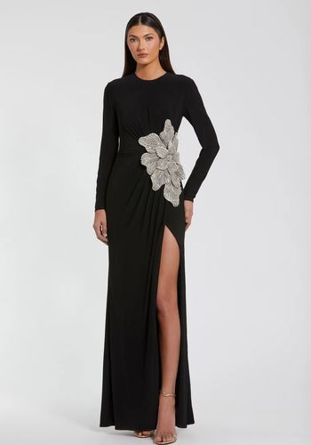 jersey long sleeve white tie gown with embellished flower and leg split