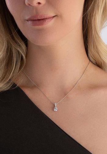 silver tone delicate chain pendant necklace with three Swarovski crystals that hold the larger Swarovski crystal