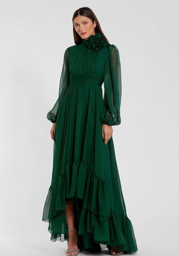 Green high low winter wedding guest dress, featuring mock neckline with 3D flower, sheer long puff sleeves, and ruched bodice. 