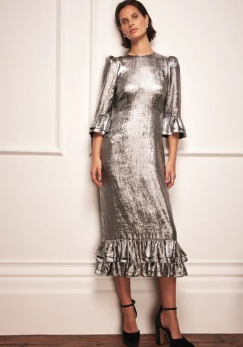 Silver metallic winter wedding guest dress in a midi silhouette with crew neckline, puff shoulders, 3/4 ruffle