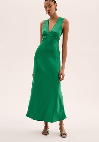 emerald green winter bridesmaid dress, featuring a deep neckline, open back and soft satin-like shine 